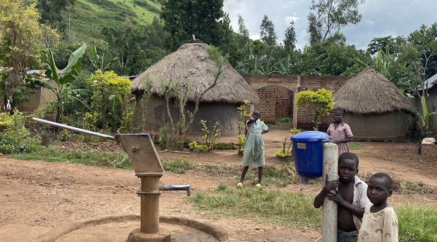 Children by a water pump in a village